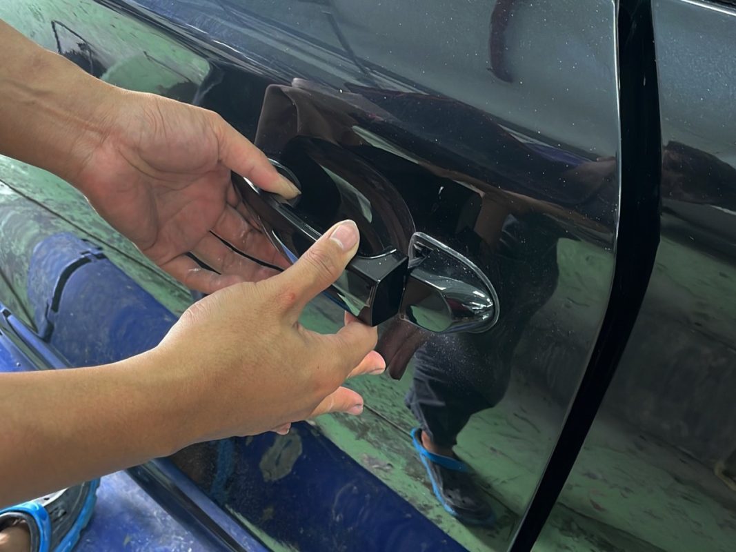 Buffing the new paint on the 130i to bring up the shine.