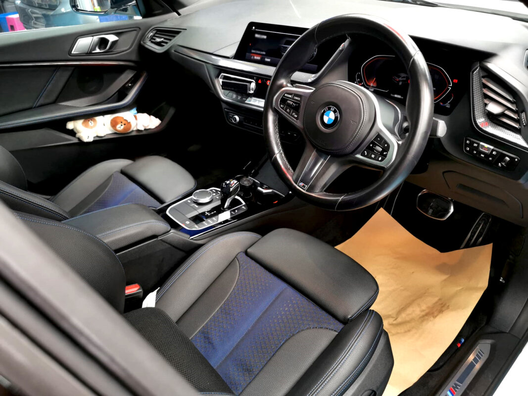 The BMW 2 Series parked in the workshop, freshly coated.