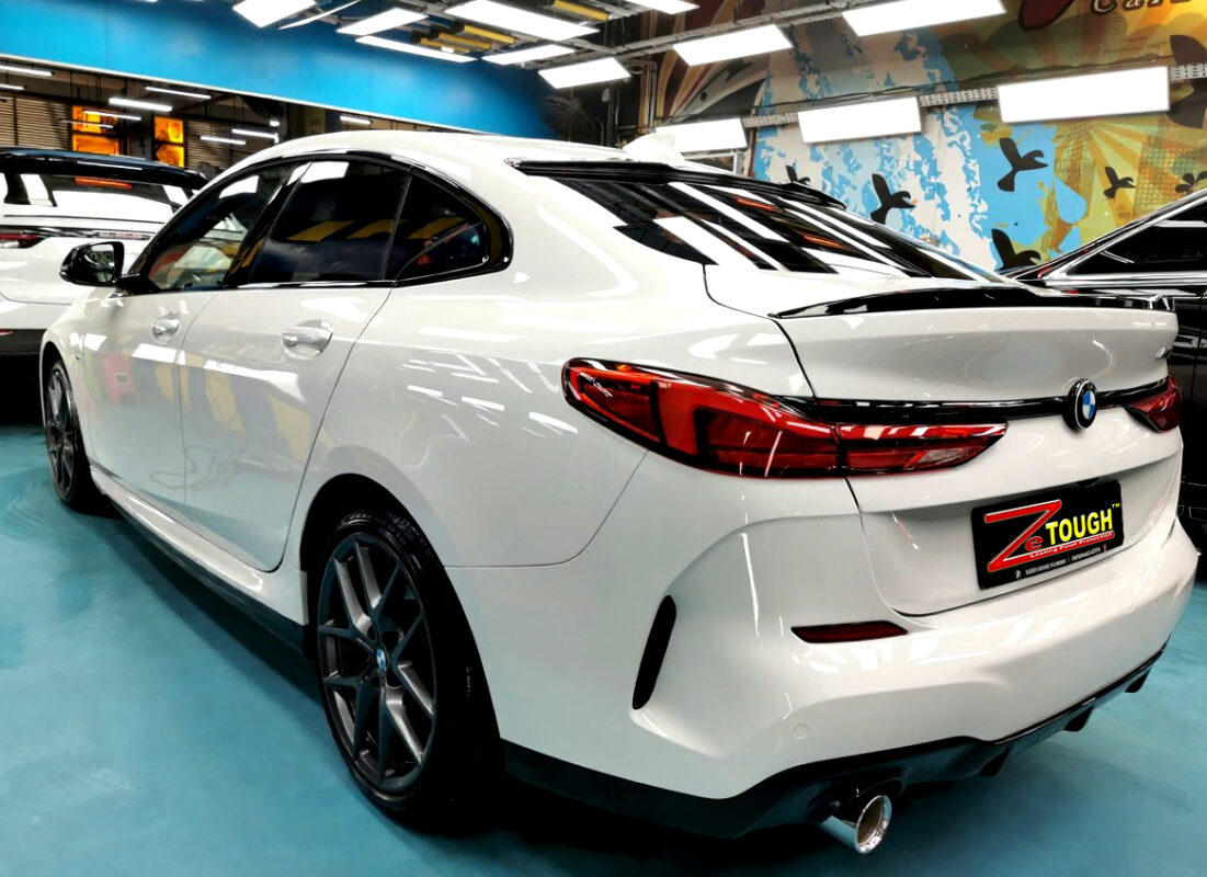 Rear quarter of the BMW 2 Series, glossy and protected.