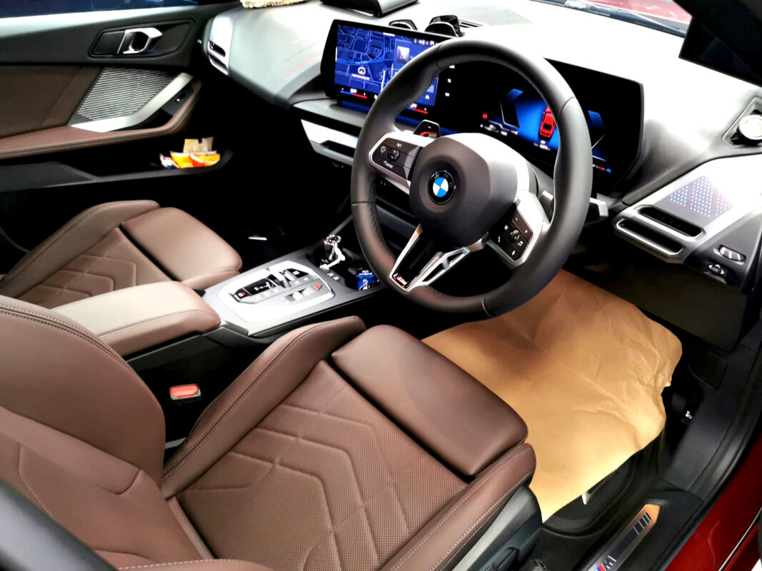 The BMW 2 Series parked in the workshop, freshly coated.