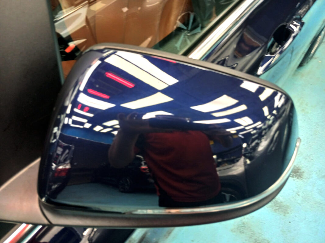 The BMW 2 Series parked in the workshop, freshly coated.
