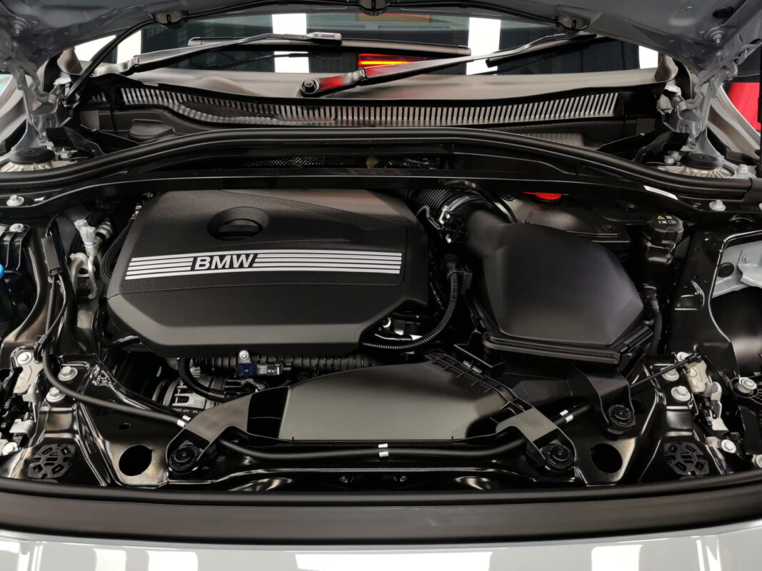 Reflections across the coated panels of the BMW 2 Series.