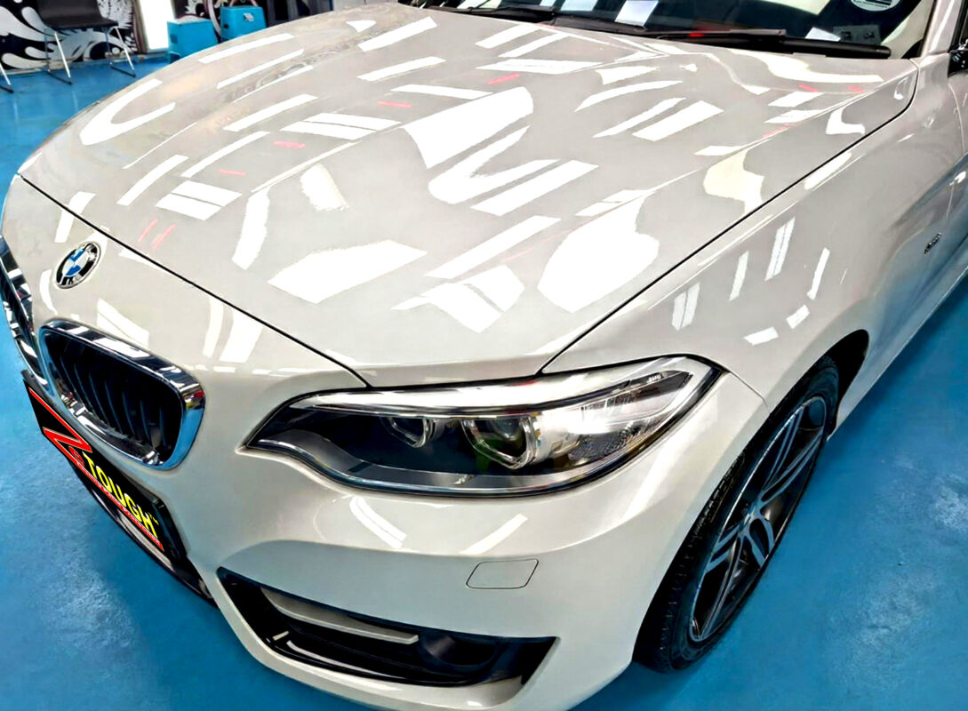 The BMW 2 Series's coated paintwork under workshop lighting.