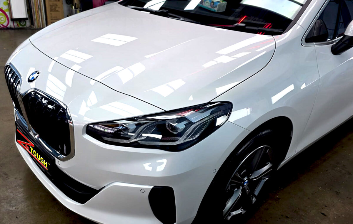 The BMW 2 Series's coated paintwork under workshop lighting.