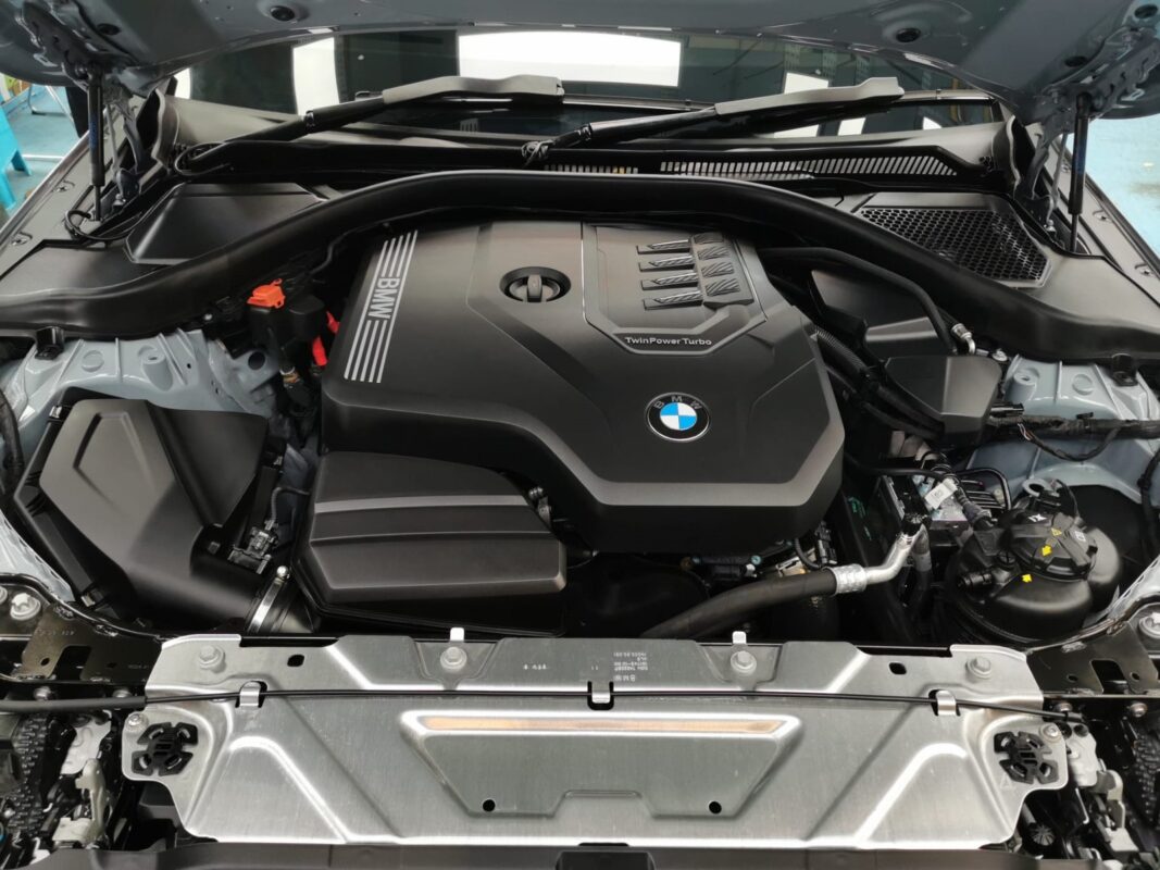 Reflections across the coated panels of the BMW 2 Series.