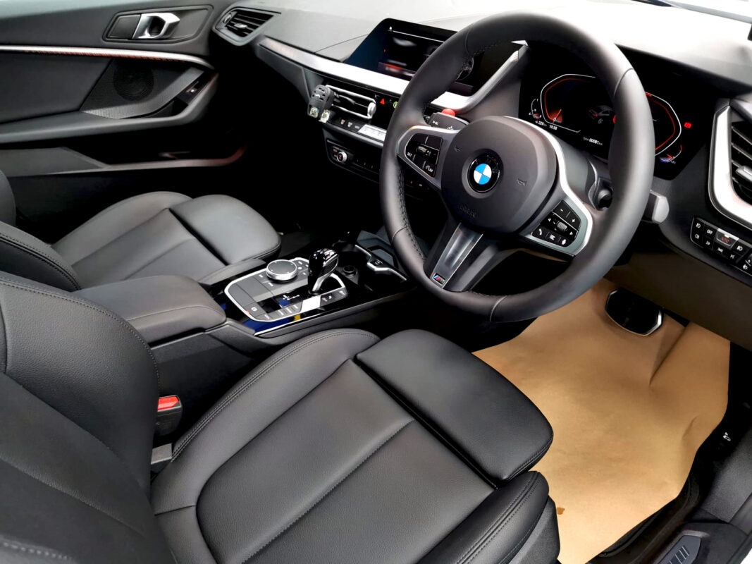 The BMW 2 Series parked in the workshop, freshly coated.