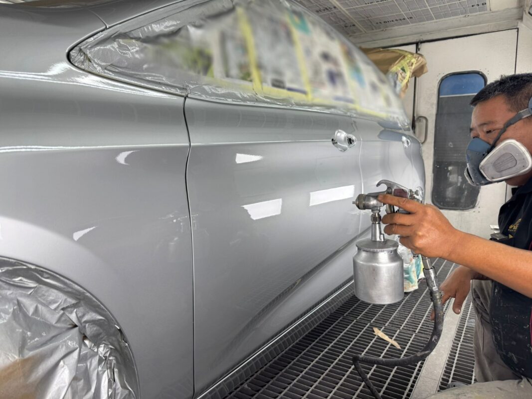 Silver BMW 2 Series, glossy after its full respray.