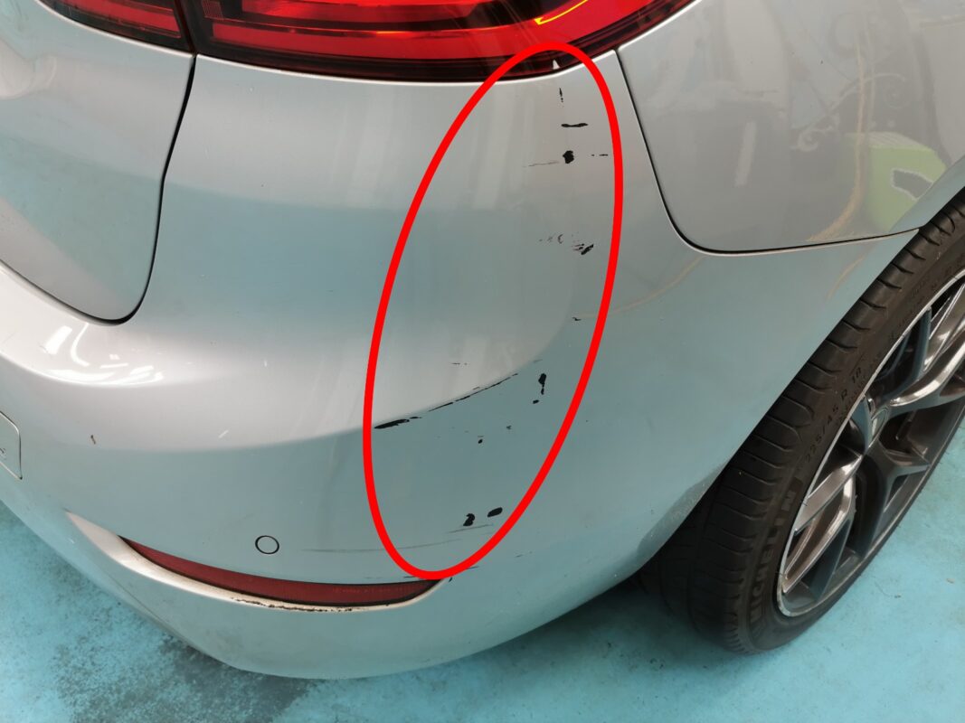 A rear panel scuff on the BMW 2 Series marked up before repair.