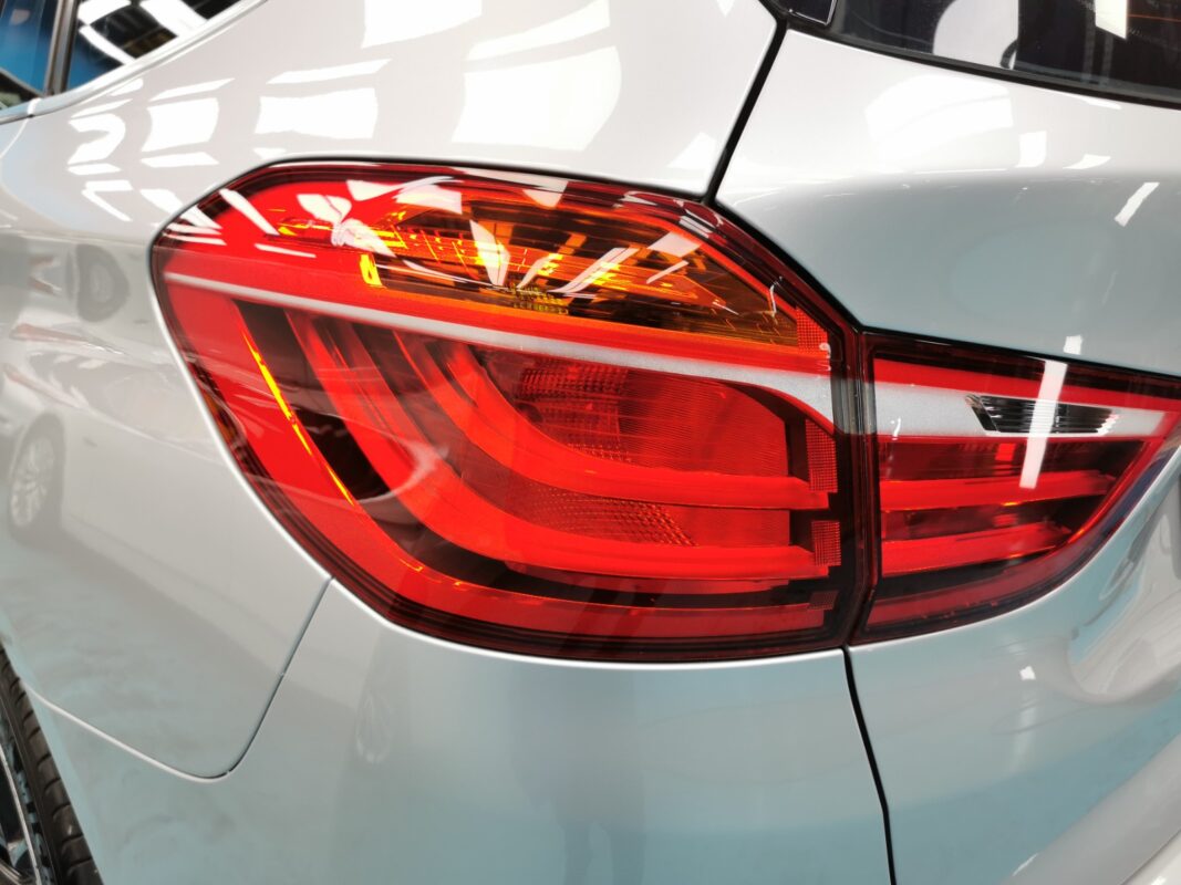The resprayed rear quarter and tail light on the finished BMW 2 Series.
