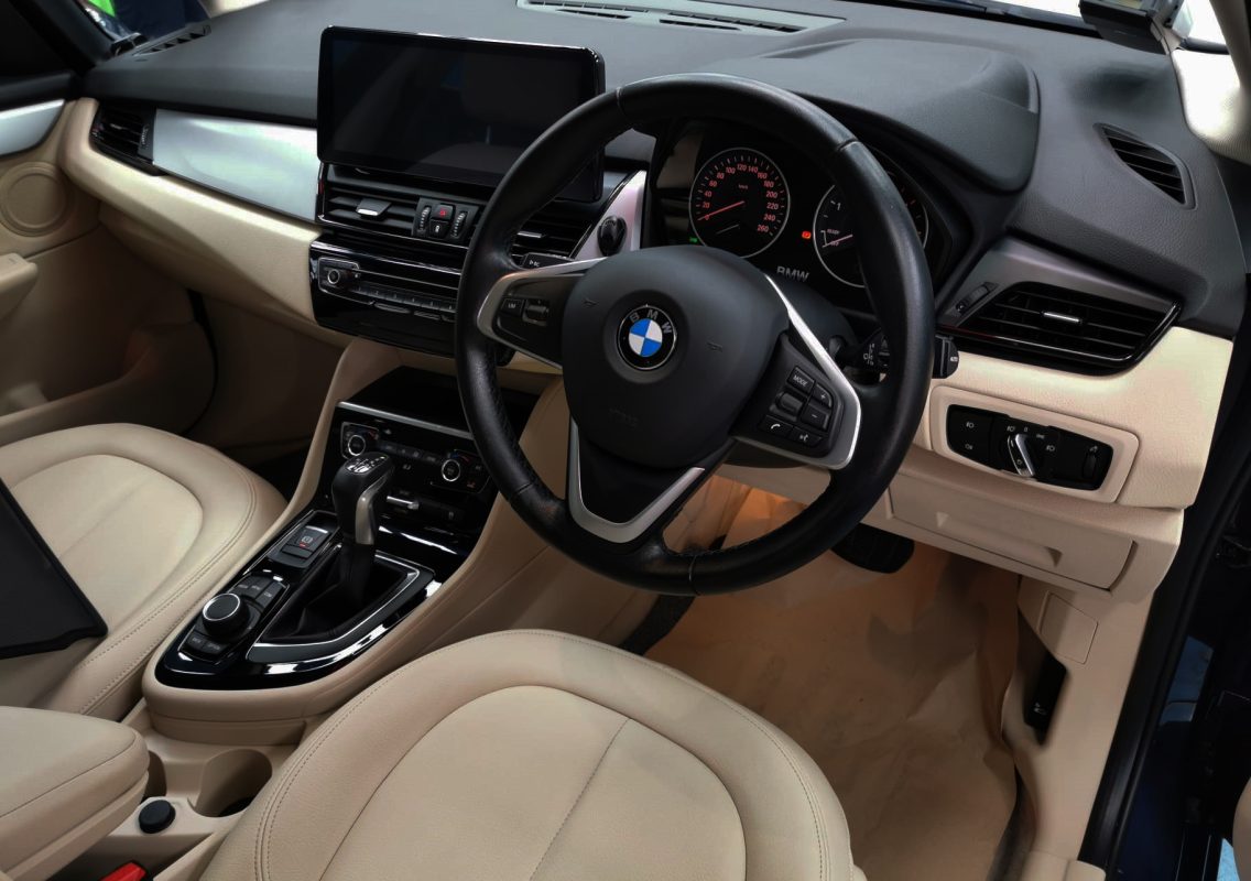 The BMW 2 Series parked in the workshop, freshly coated.