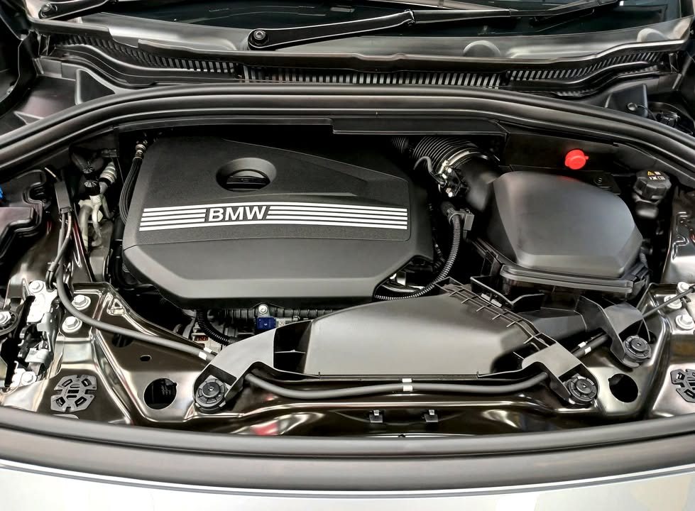 Engine bay of the 2 Series with the bonnet open.