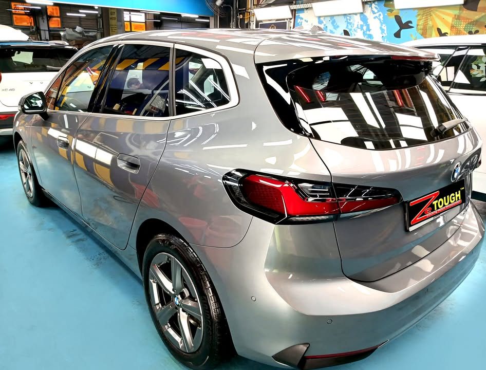 Rear three-quarter view of the grey BMW 2 Series.