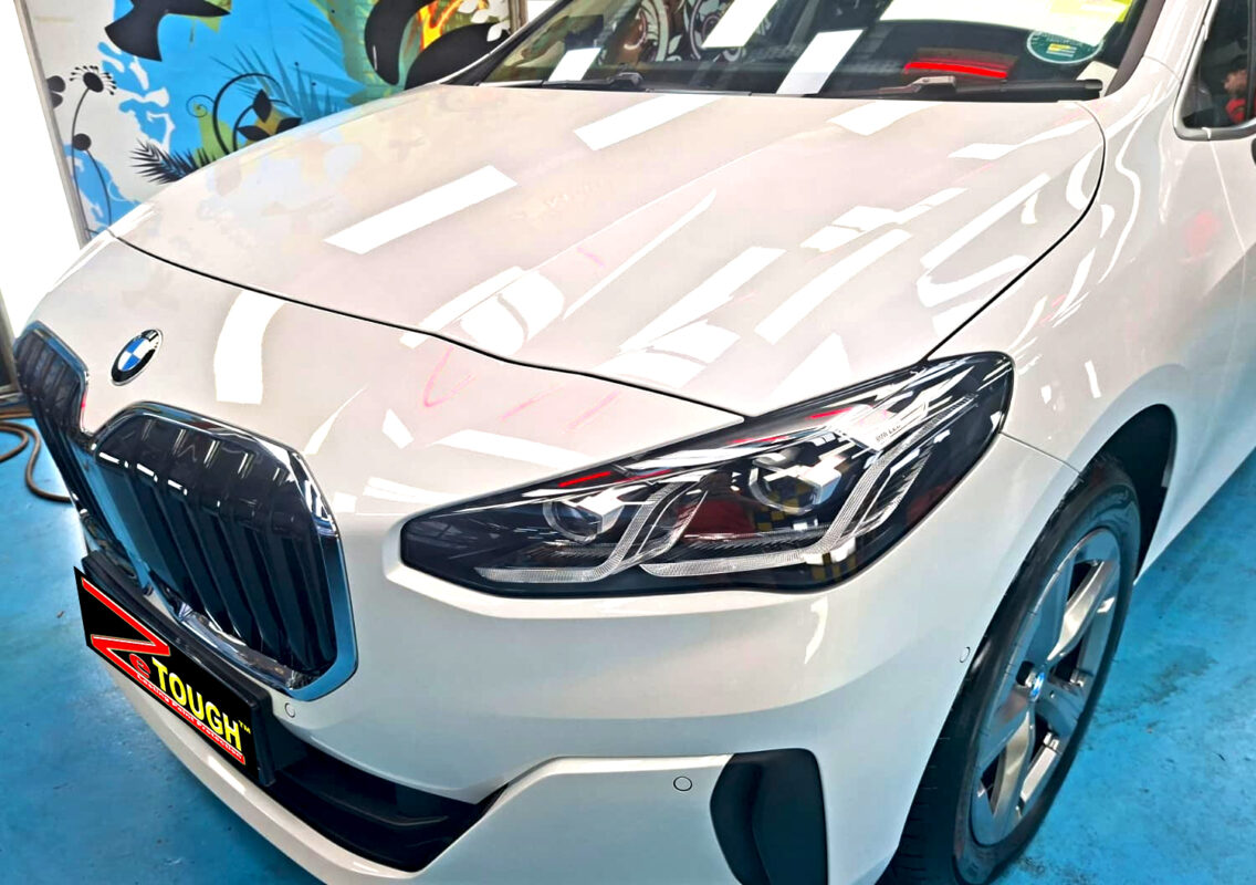The BMW 2 Series's coated paintwork under workshop lighting.