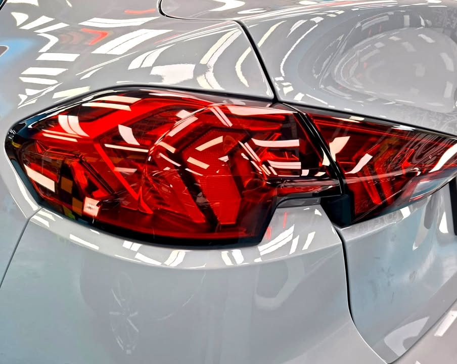 Close-up of the 2 Series tail light against grey paint.