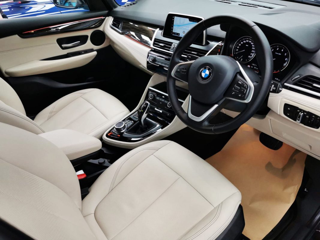 The BMW 216 GT parked in the workshop, freshly coated.