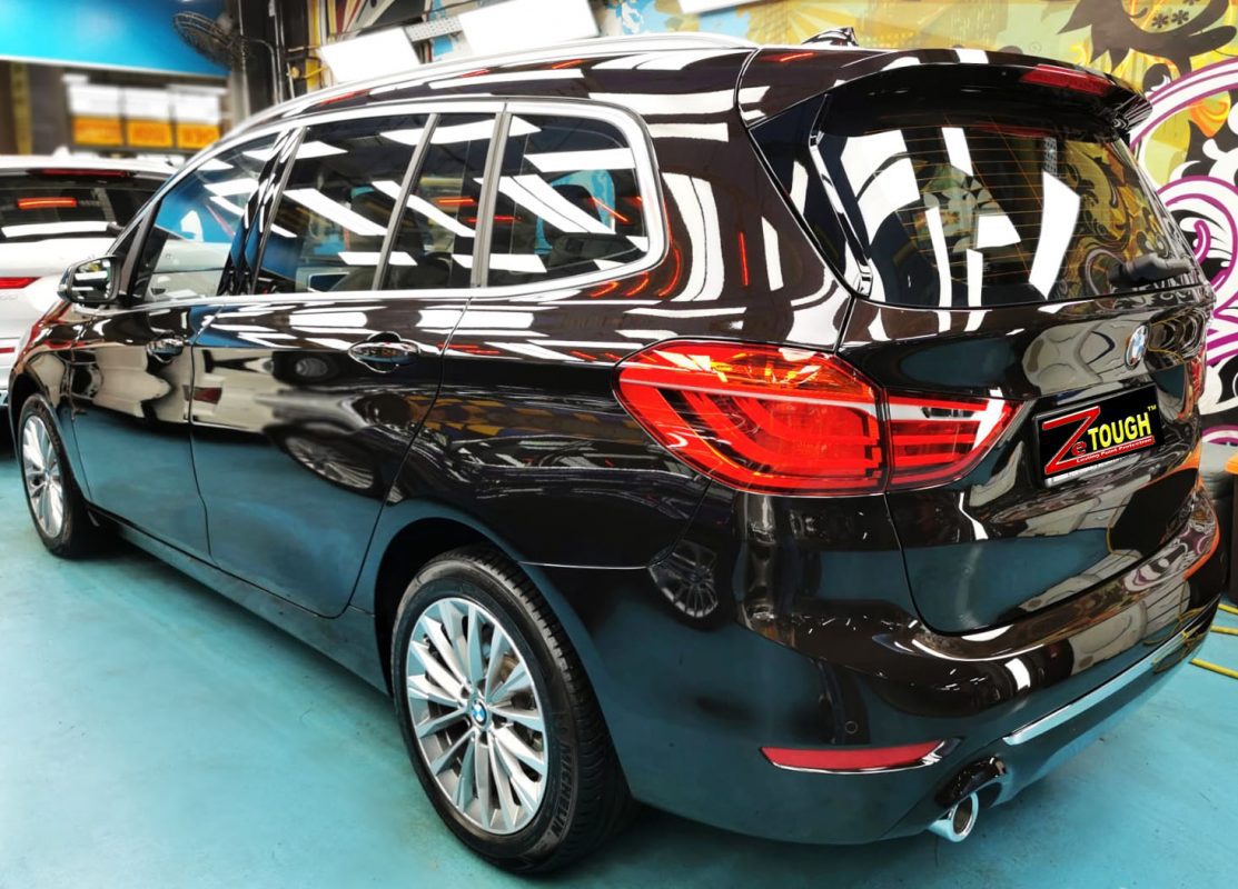 Rear quarter of the BMW 216 GT, glossy and protected.