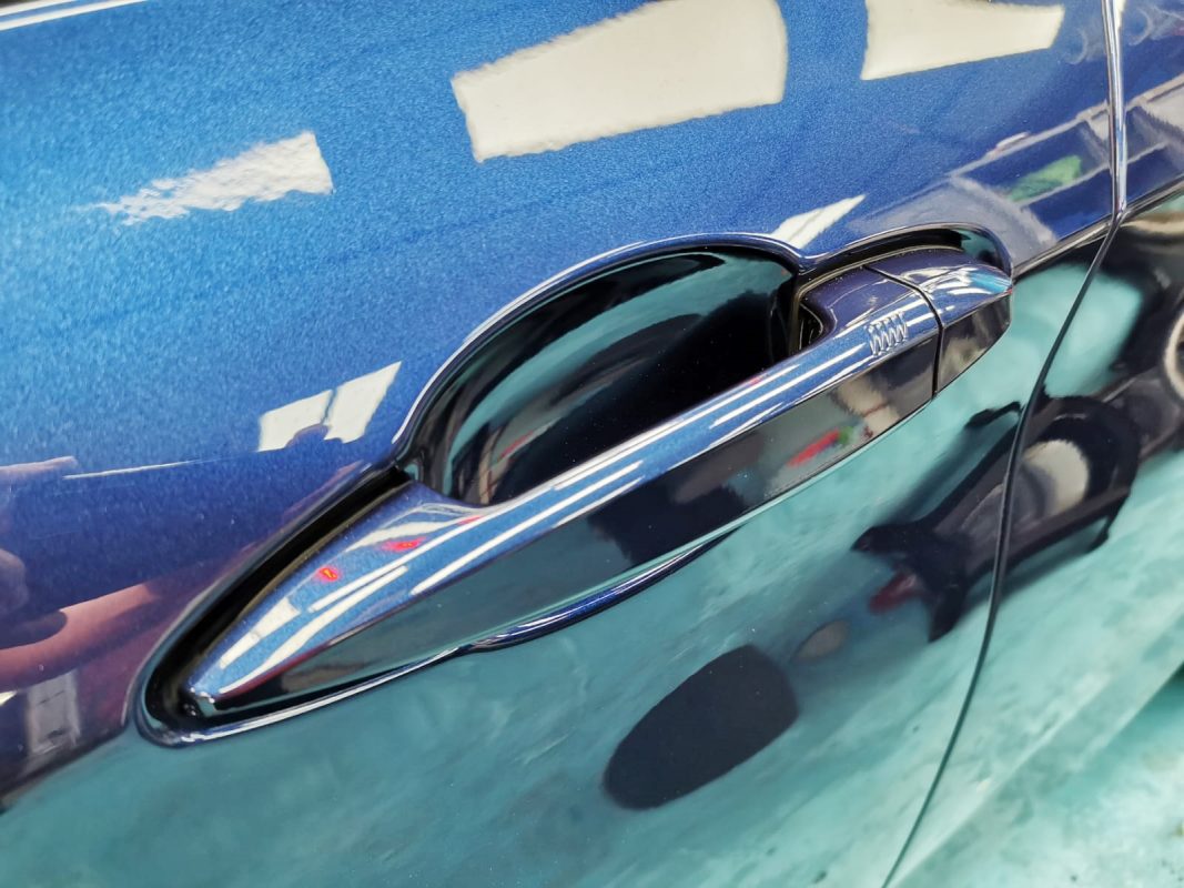 Front three-quarter view of the BMW 216D Active Tourer after coating.