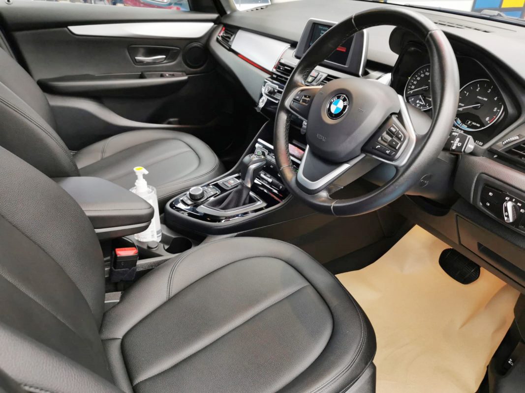 The BMW 216D parked in the workshop, freshly coated.