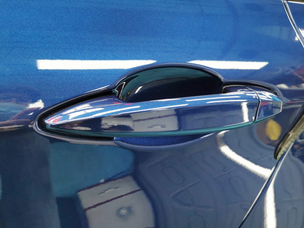 Front three-quarter view of the BMW 216D after coating.