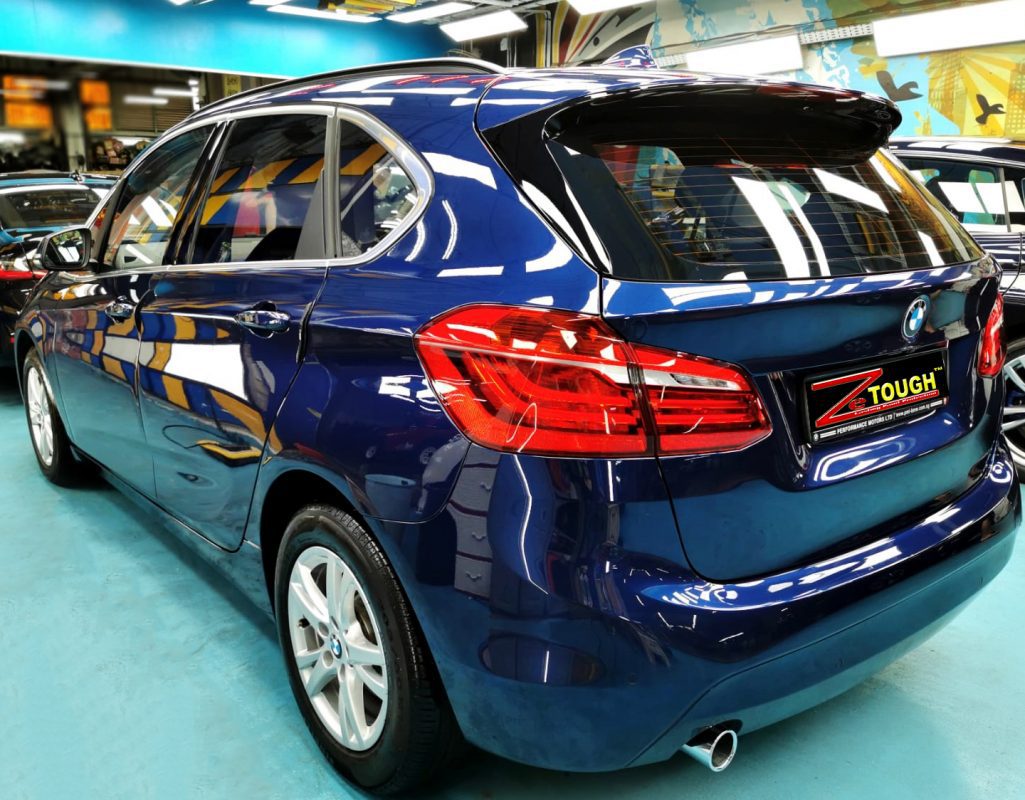 Rear quarter of the BMW 216D, glossy and protected.