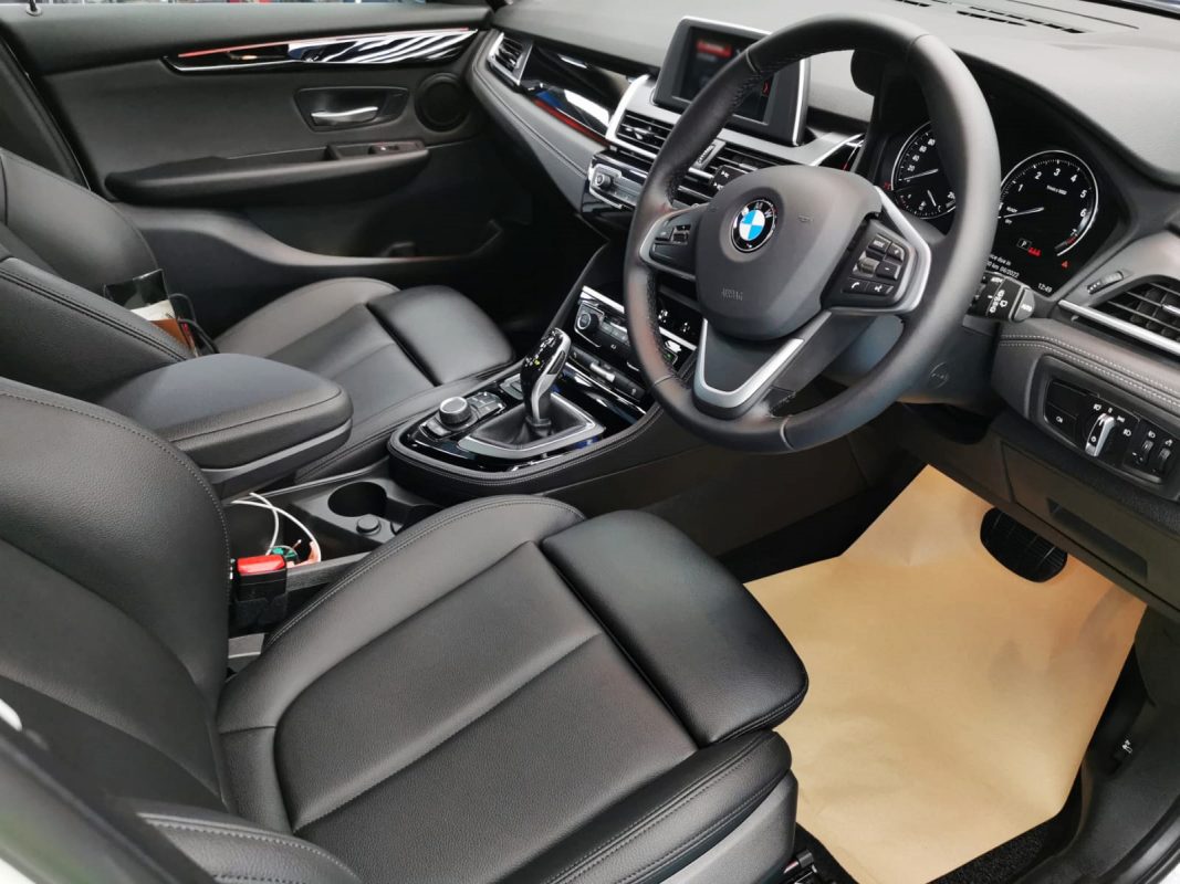 The BMW 216D parked in the workshop, freshly coated.