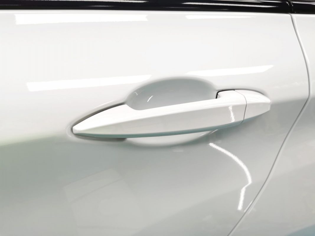 Front three-quarter view of the BMW 216D after coating.