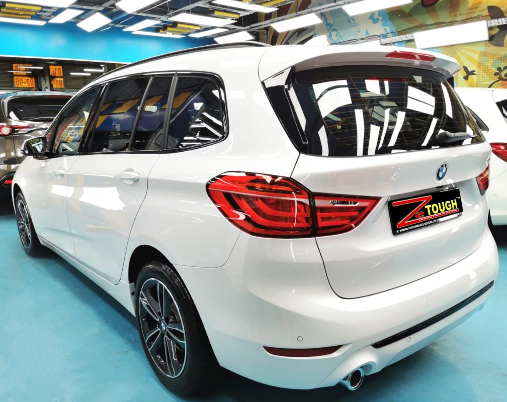 Rear quarter of the BMW 216D, glossy and protected.