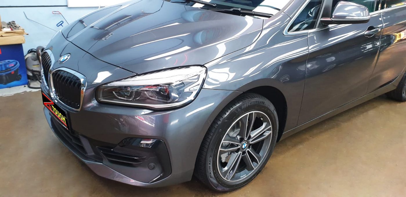 The BMW 216GT from a side angle after the ceramic coating.