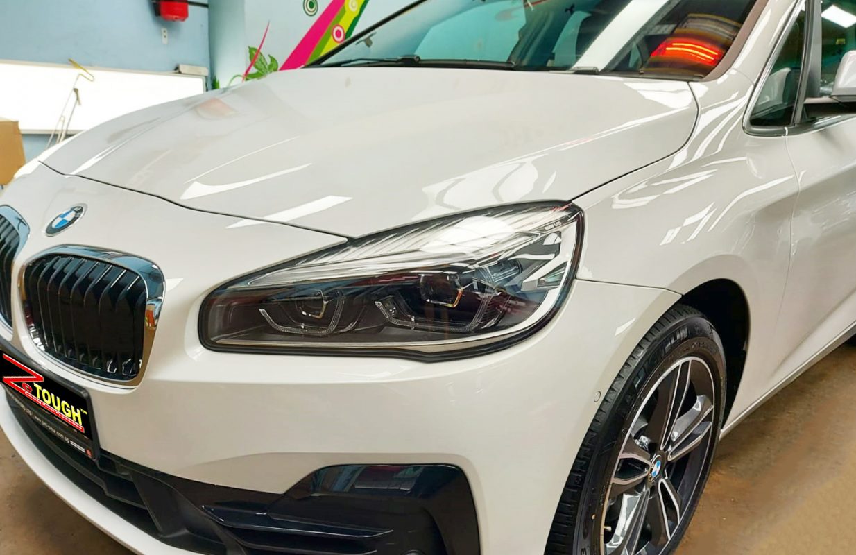 The BMW 216i from a side angle after the ceramic coating.