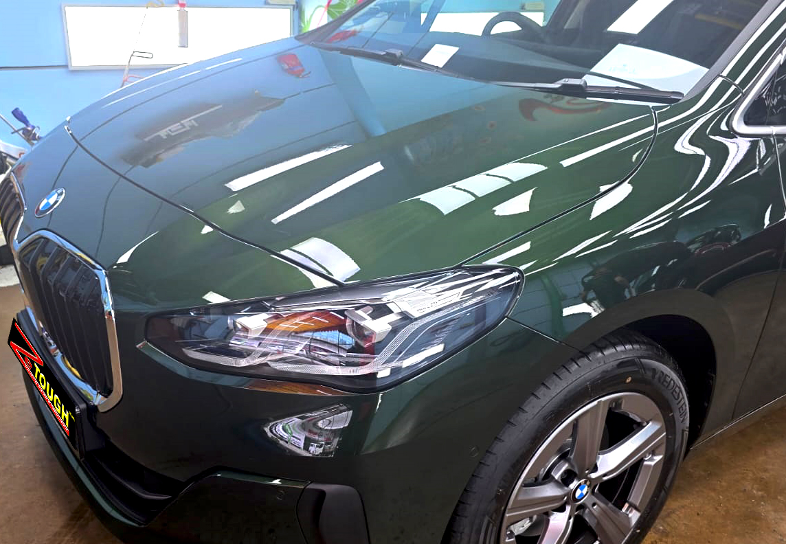 The BMW 216i from a side angle after the ceramic coating.