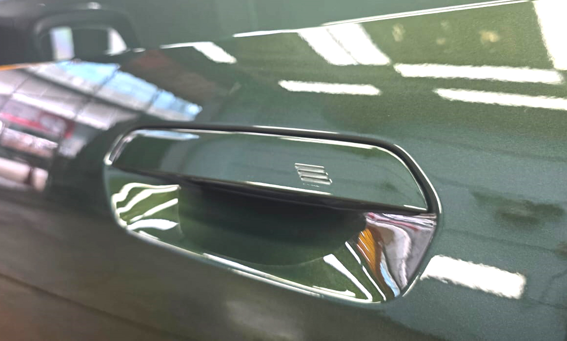 Front three-quarter view of the BMW 216i after coating.