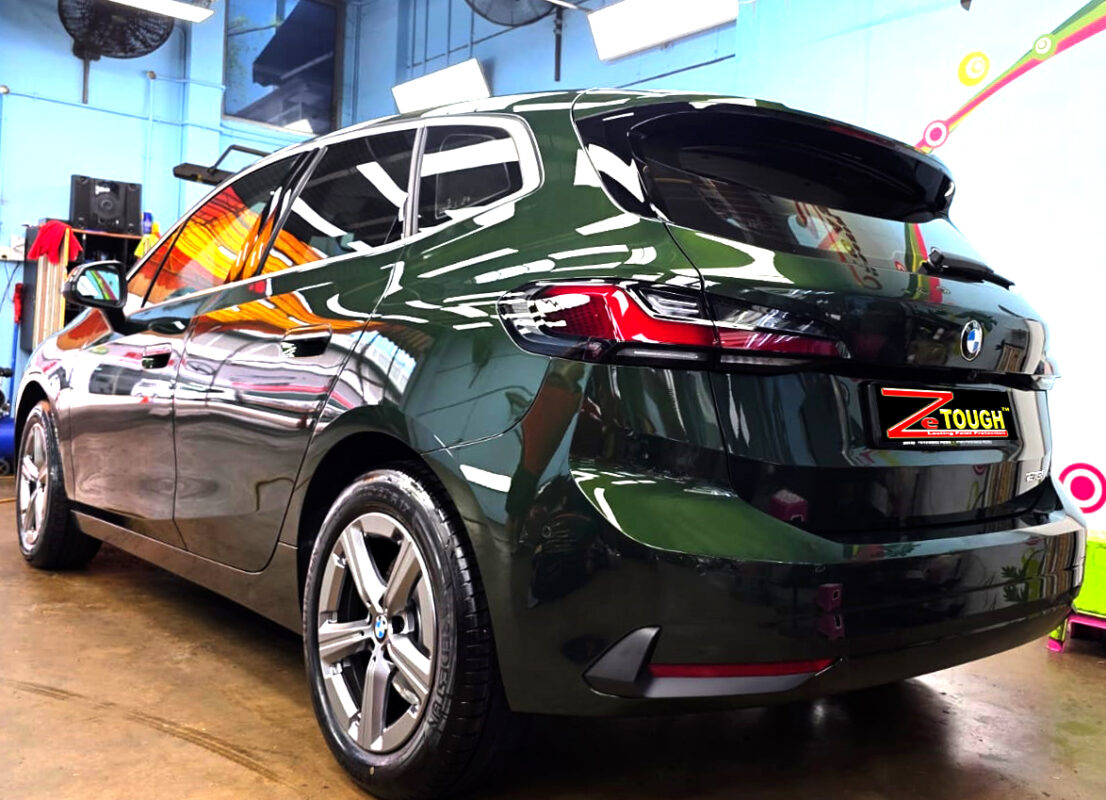 Rear quarter of the BMW 216i, glossy and protected.