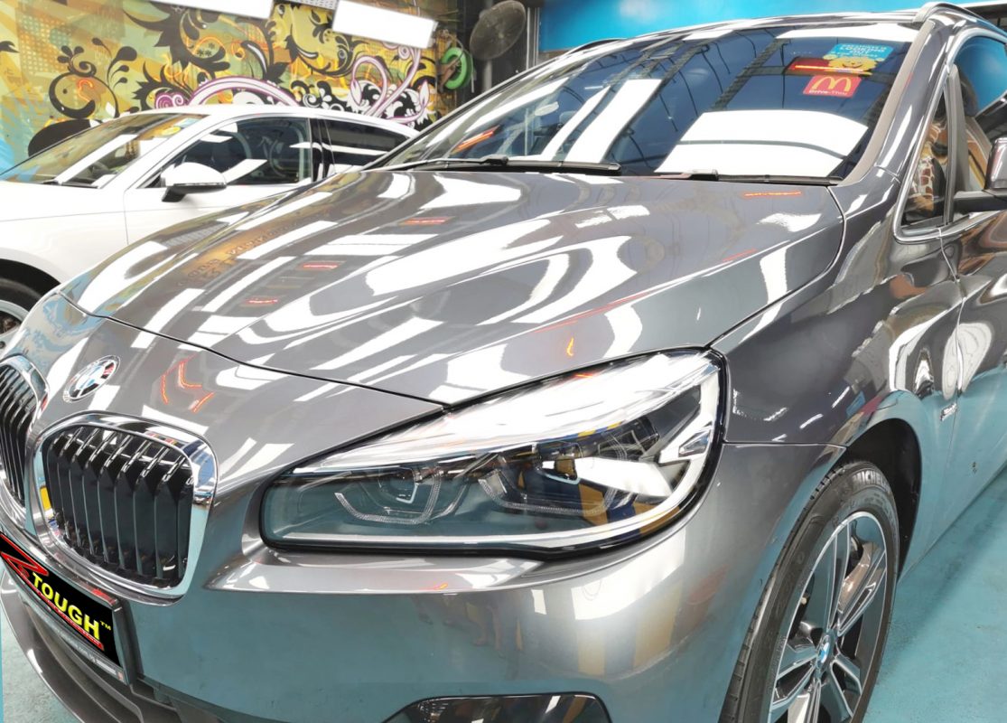The BMW 216i from a side angle after the ceramic coating.