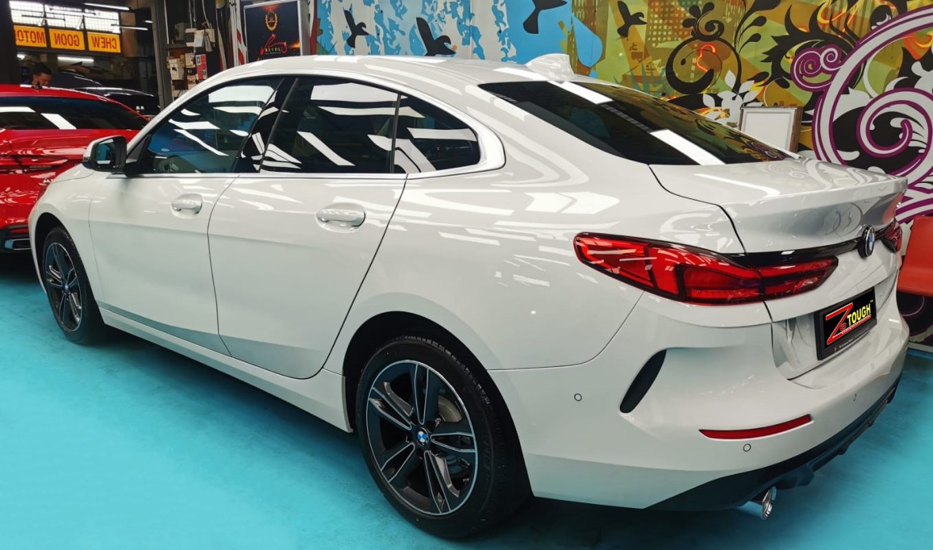 Rear quarter of the BMW 216i, glossy and protected.