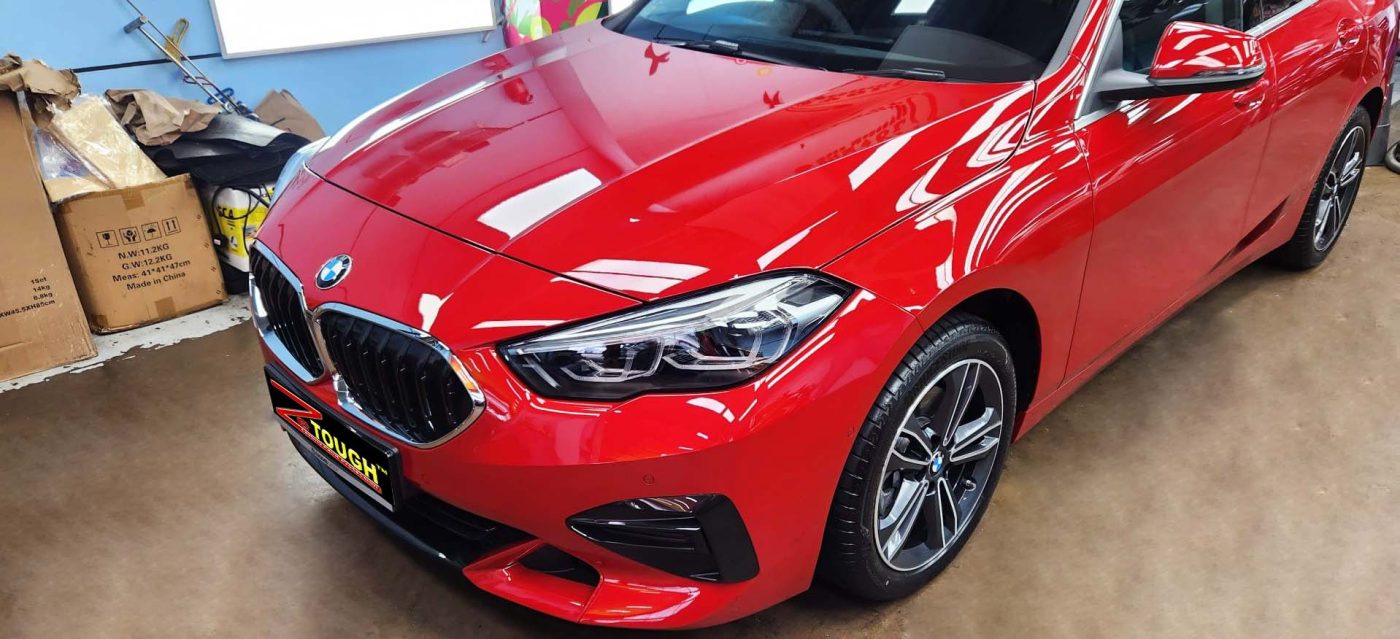 The BMW 216i GC from a side angle after the ceramic coating.