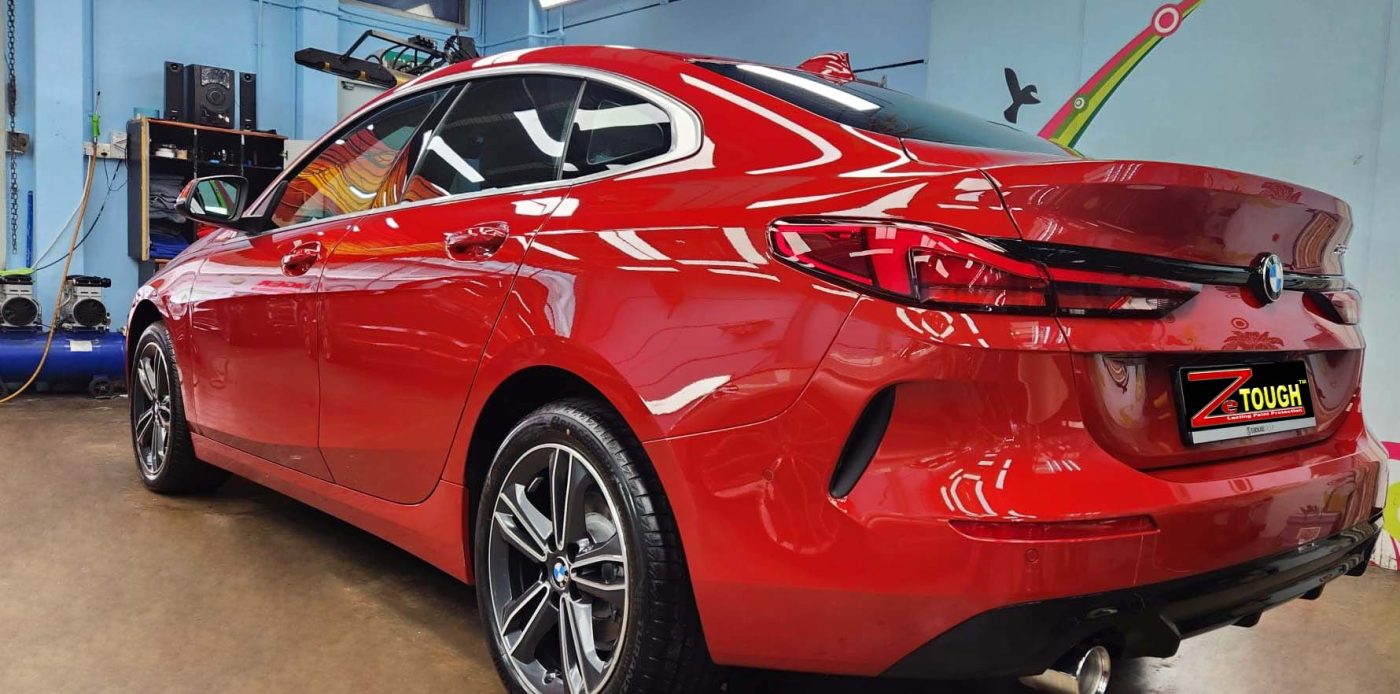 Rear quarter of the BMW 216i GC, glossy and protected.
