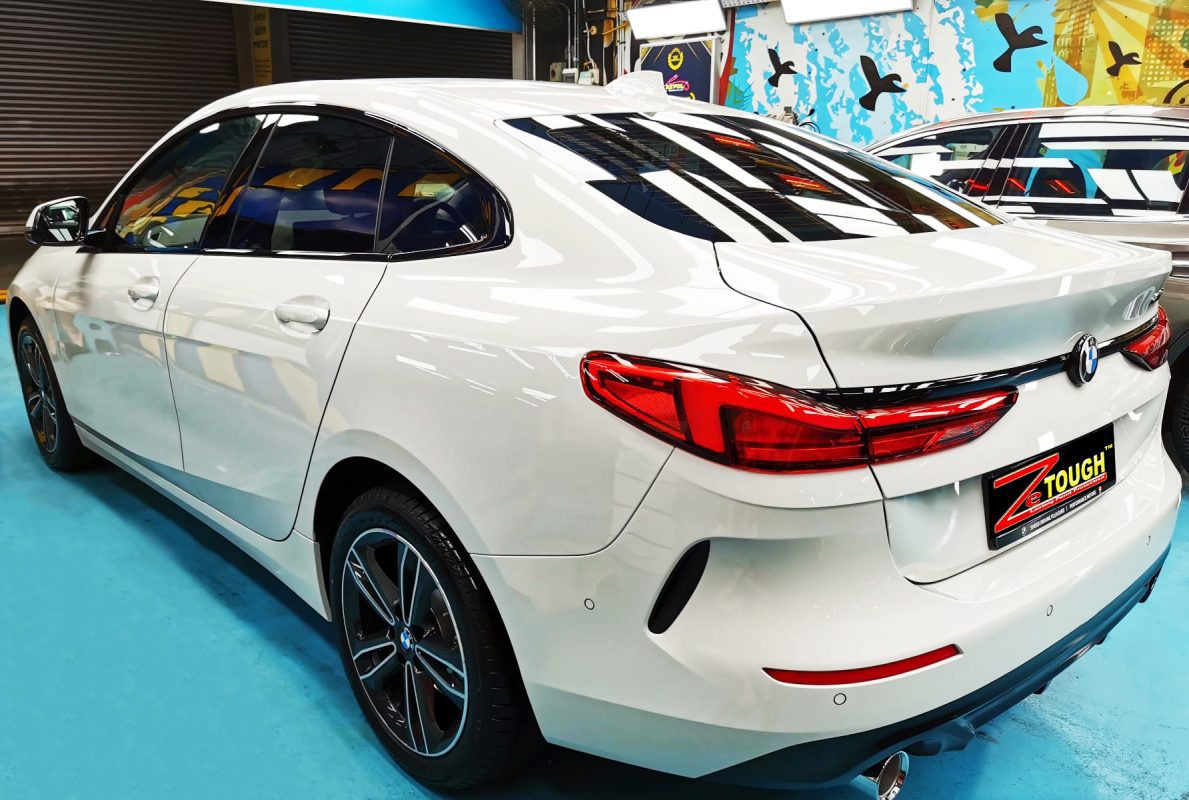 Rear quarter of the BMW 216i GC, glossy and protected.