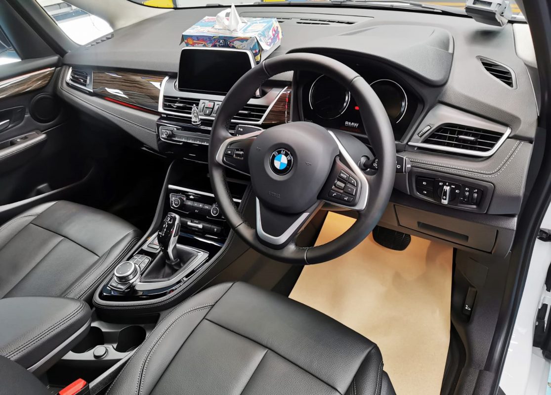 The BMW 216i Gran Tourer parked in the workshop, freshly coated.