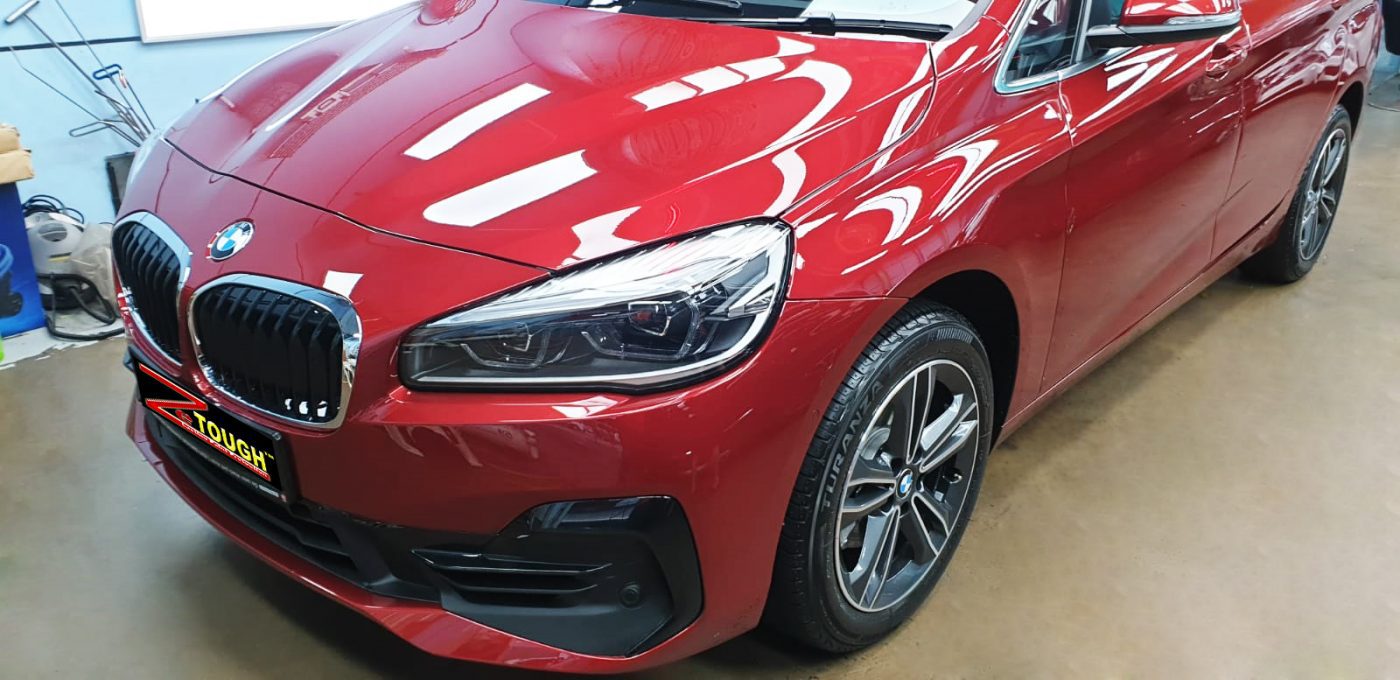 The BMW 216i GT from a side angle after the ceramic coating.