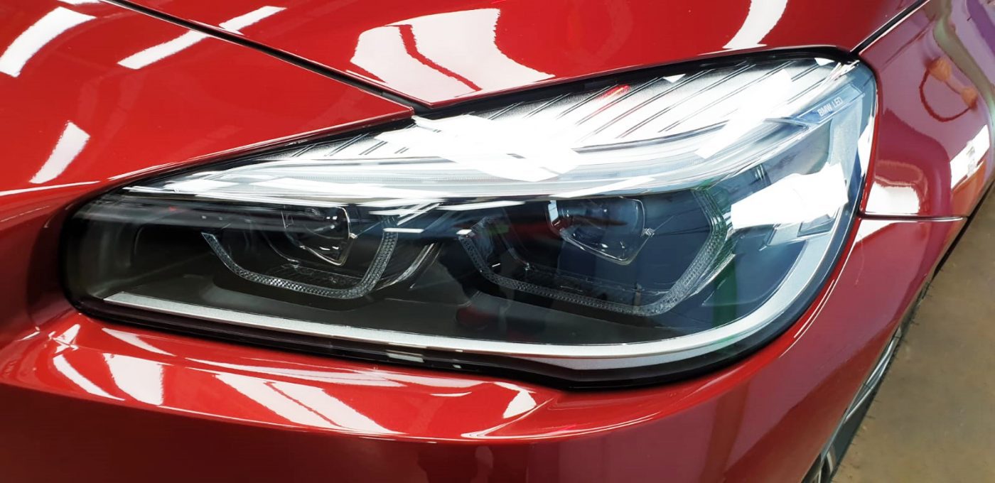 The 216i GT's coated paintwork showing clean reflections.