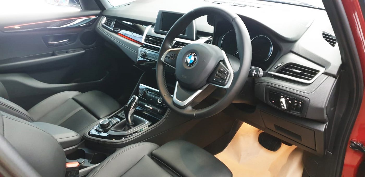 The BMW 216i GT parked in the workshop, freshly coated.