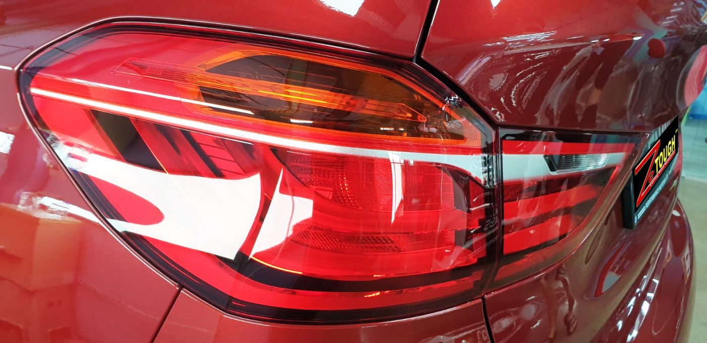 Rear quarter of the BMW 216i GT, glossy and protected.