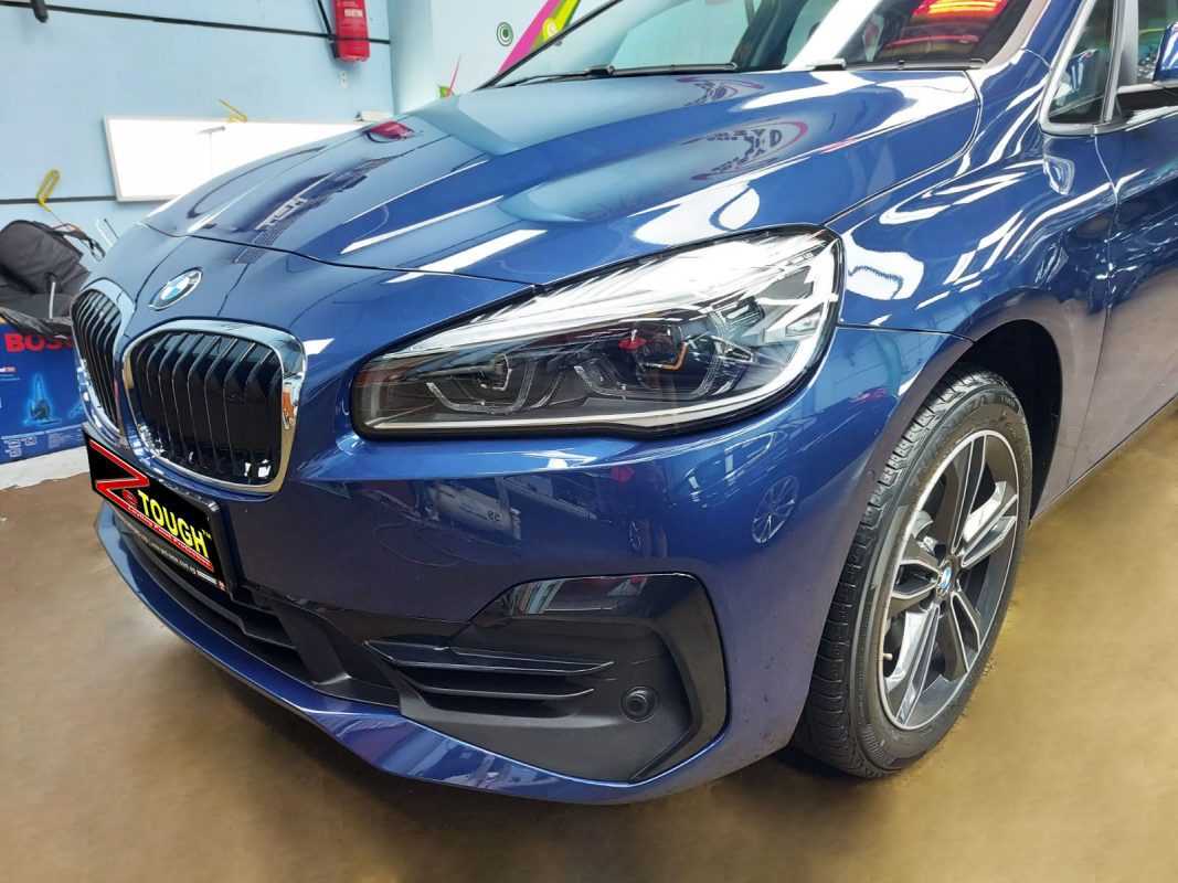 The BMW 216i GT from a side angle after the ceramic coating.