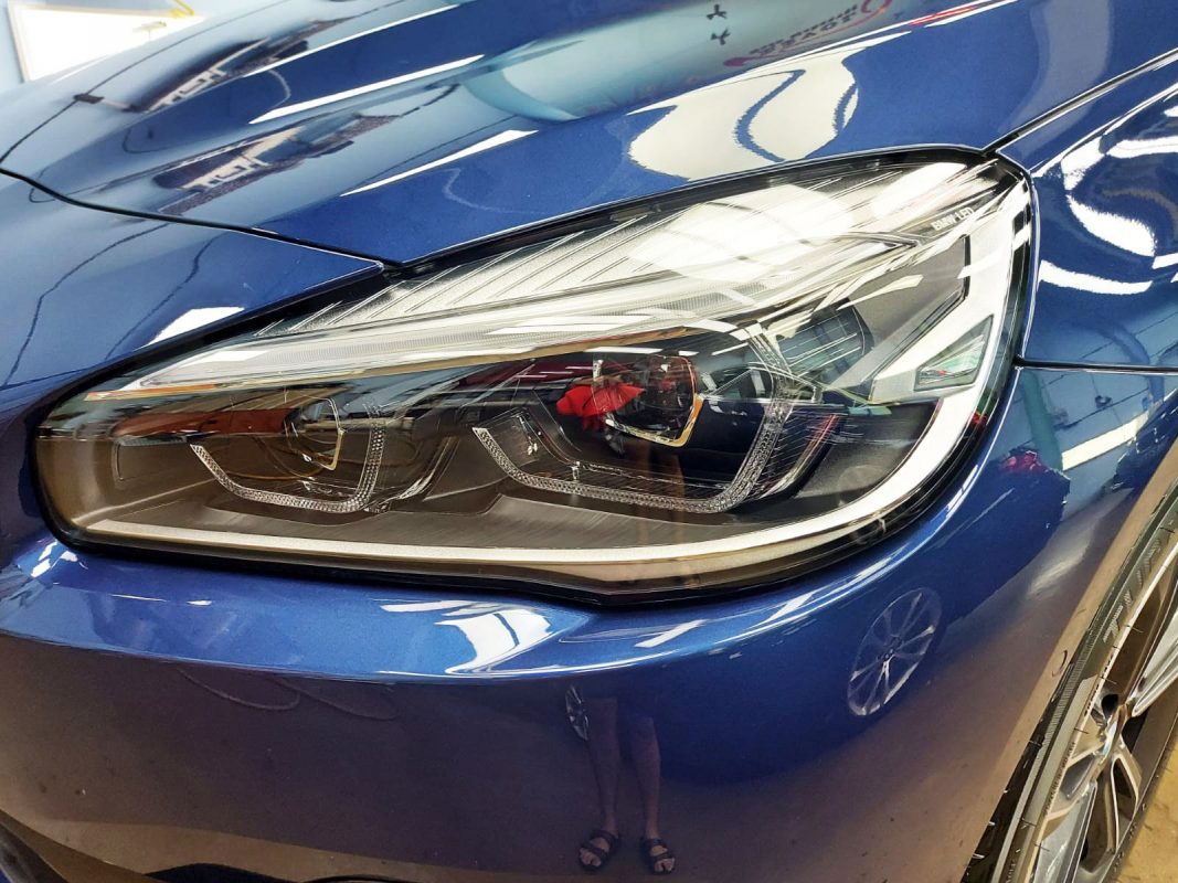 The 216i GT's coated paintwork showing clean reflections.