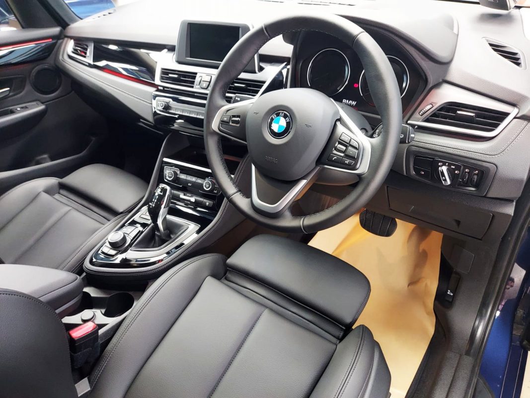 The BMW 216i GT parked in the workshop, freshly coated.