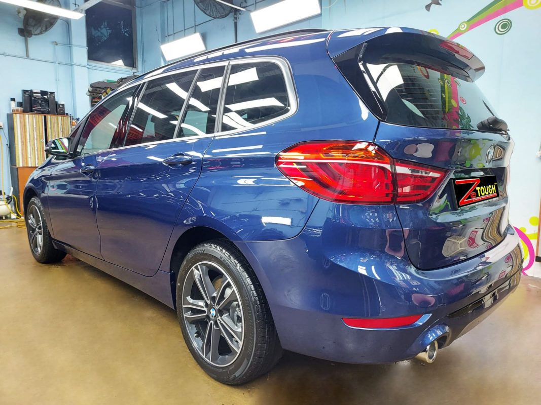 Rear quarter of the BMW 216i GT, glossy and protected.
