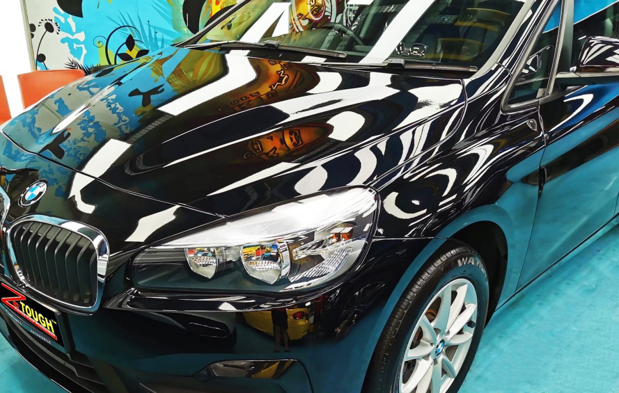 The BMW 216i GT from a side angle after the titanium coating.