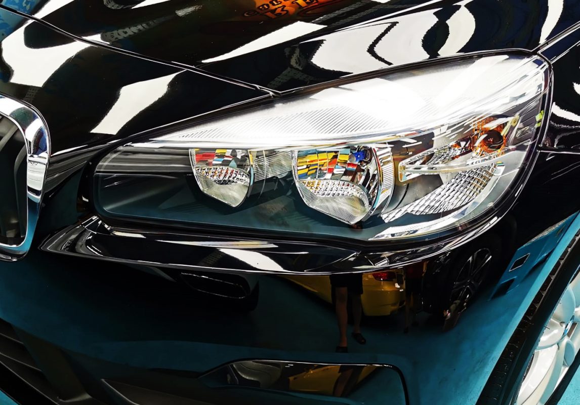 The 216i GT's coated paintwork showing clean reflections.