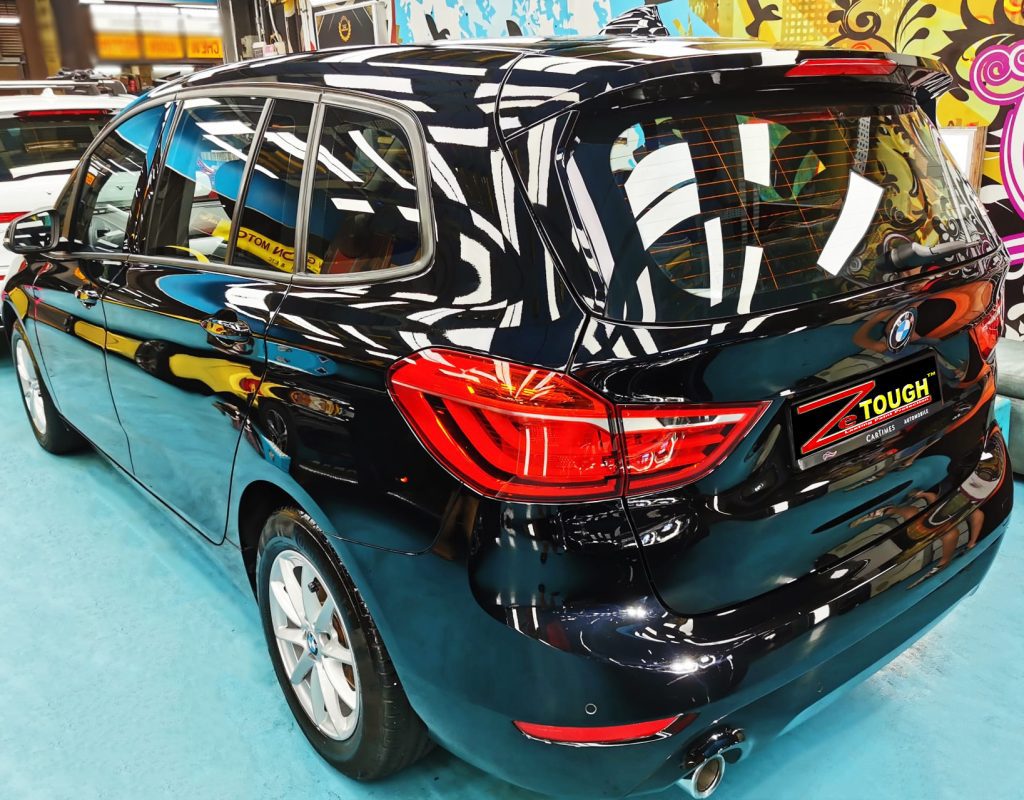 Rear quarter of the BMW 216i GT, glossy and protected.