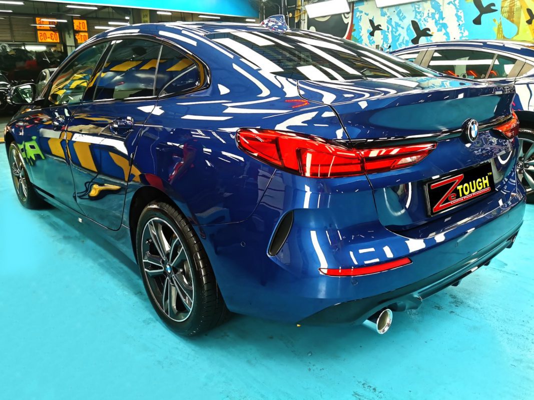 Rear quarter of the BMW 216i, glossy and protected.
